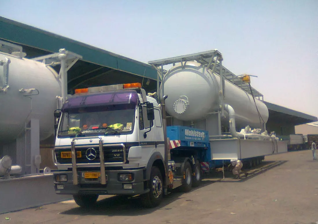 Large industrial vessel transported on a specialized trailer